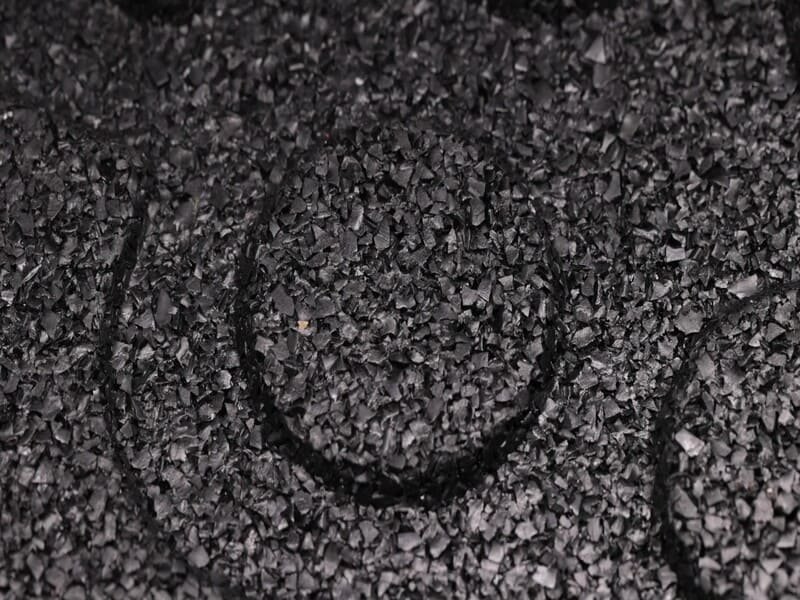 Liquid water beading on waterproof vulcanized gym mat vs absorbing into porous crumb rubber